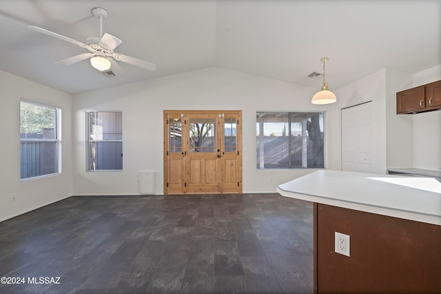 kitchen with pendant lighting, dark hardwood / wood-style flooring, lofted ceiling, and ceiling fan