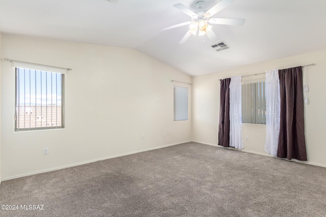 spare room with ceiling fan, carpet flooring, and lofted ceiling