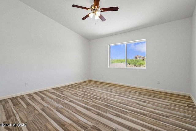 empty room with light hardwood / wood-style flooring and ceiling fan