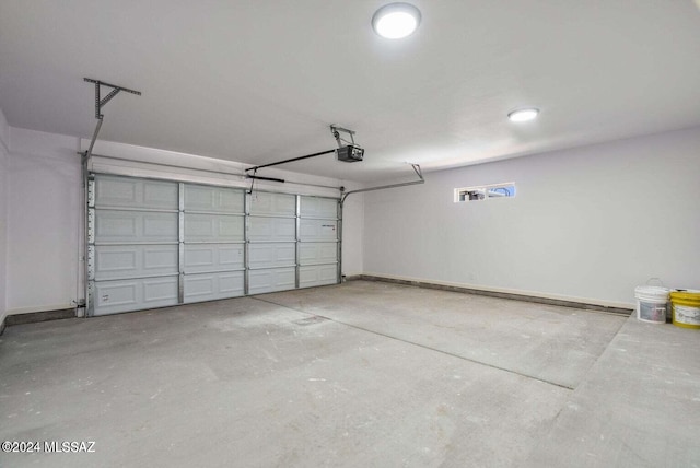 garage featuring a garage door opener