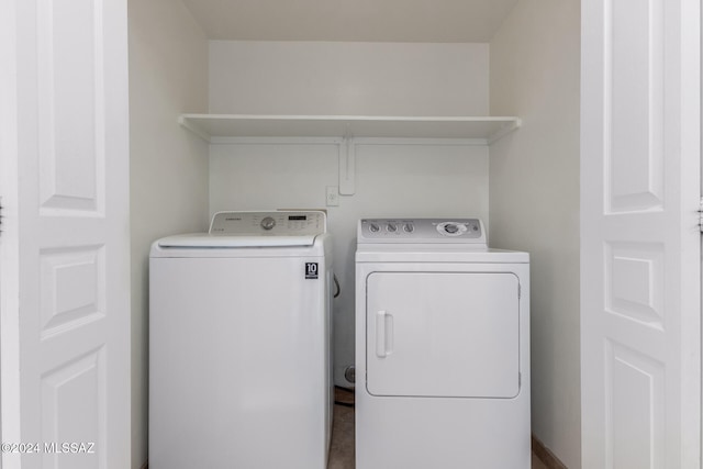 clothes washing area featuring washer and dryer