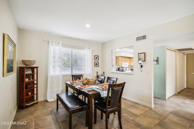 dining room with tile patterned floors