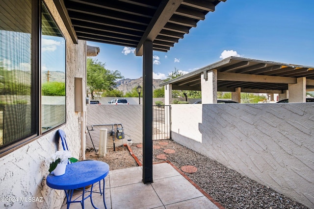 view of patio / terrace featuring a mountain view