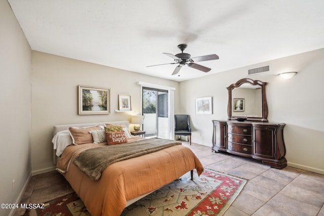 tiled bedroom with ceiling fan