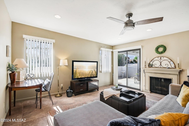 living room featuring ceiling fan and light tile patterned floors