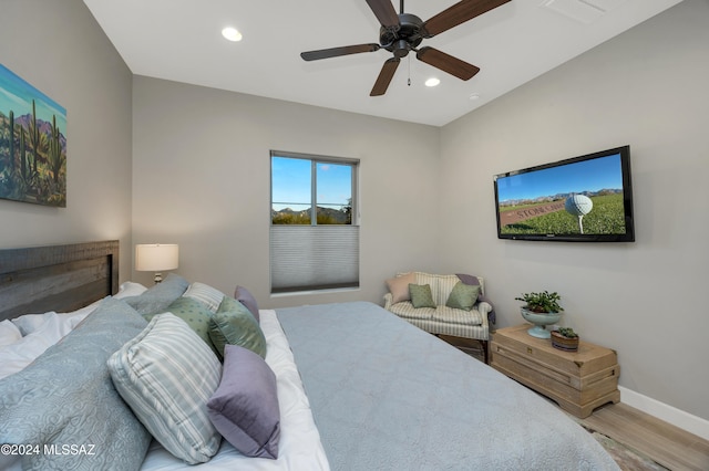 bedroom featuring ceiling fan and hardwood / wood-style flooring