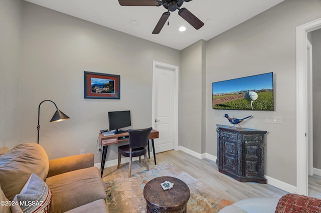 office space featuring light hardwood / wood-style floors and ceiling fan