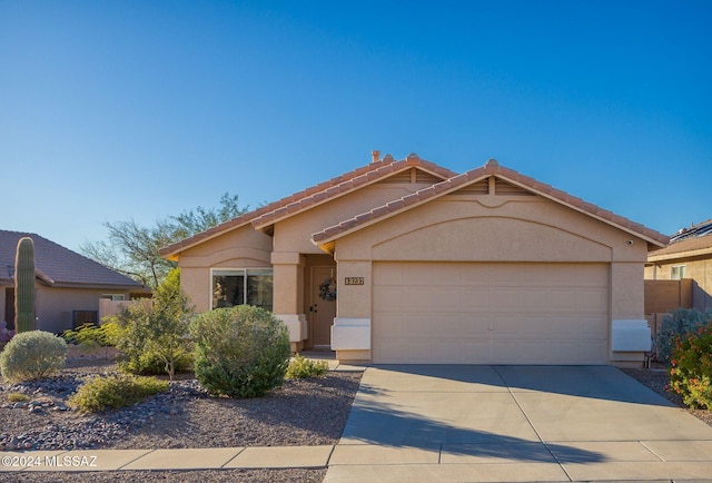 view of front of home with a garage