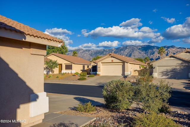 exterior space with a mountain view and a garage