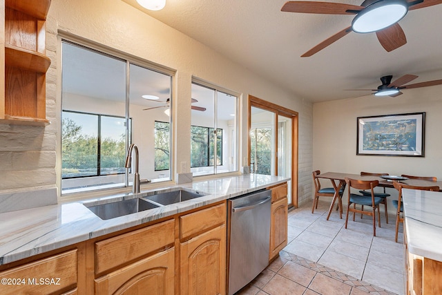 kitchen with light tile patterned floors, a sink, light countertops, dishwasher, and open shelves