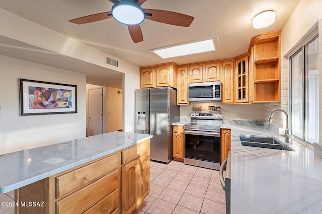 kitchen with open shelves, visible vents, appliances with stainless steel finishes, glass insert cabinets, and a sink