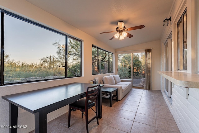 sunroom / solarium featuring vaulted ceiling and a ceiling fan