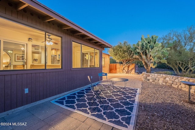 exterior space featuring a patio area and fence