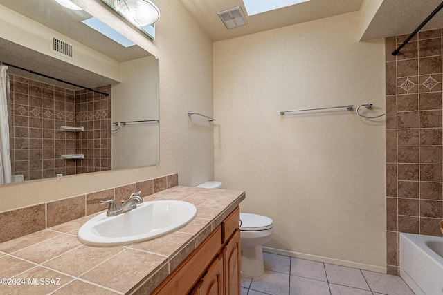 bathroom featuring tile patterned flooring, visible vents, vanity, and toilet