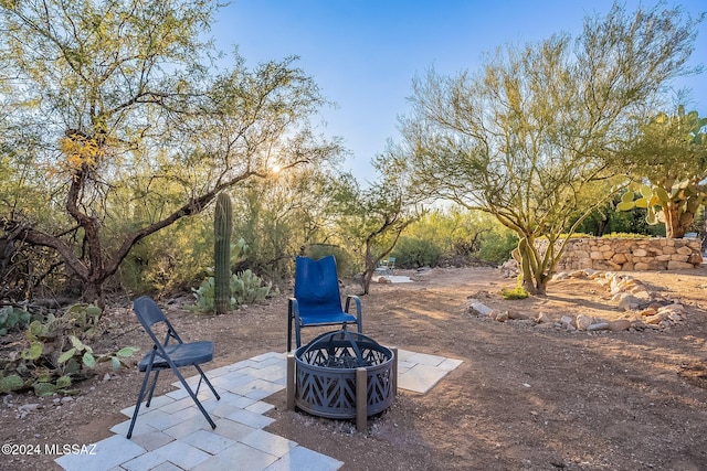 view of patio with an outdoor fire pit