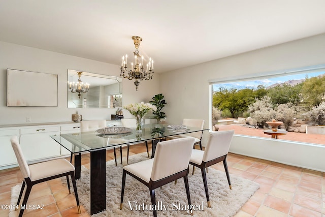 dining room with light tile patterned floors and an inviting chandelier