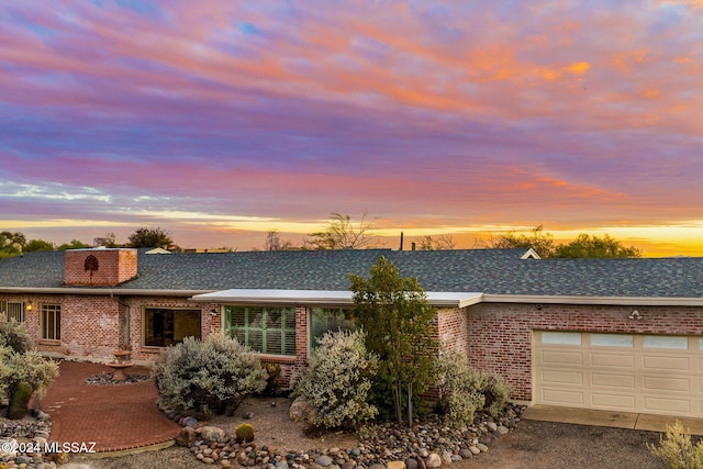 ranch-style house featuring a garage