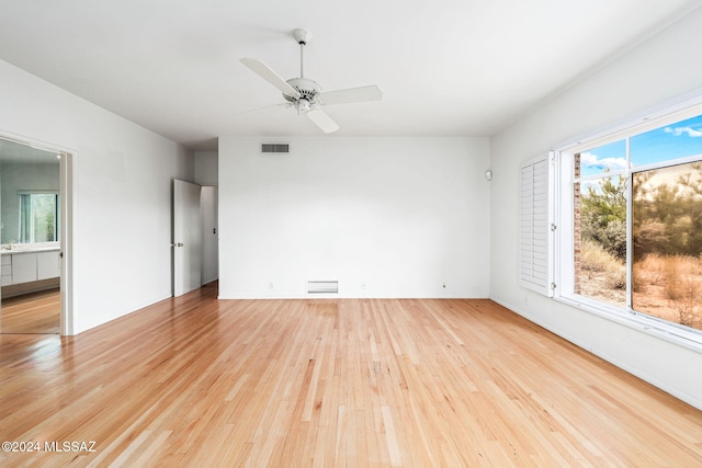 unfurnished room with ceiling fan and light wood-type flooring