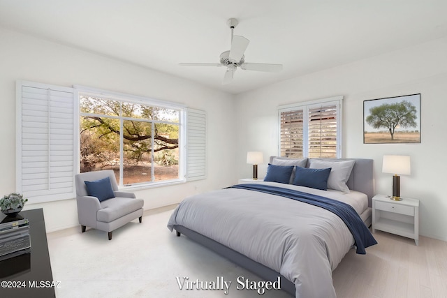 bedroom featuring ceiling fan and light wood-type flooring