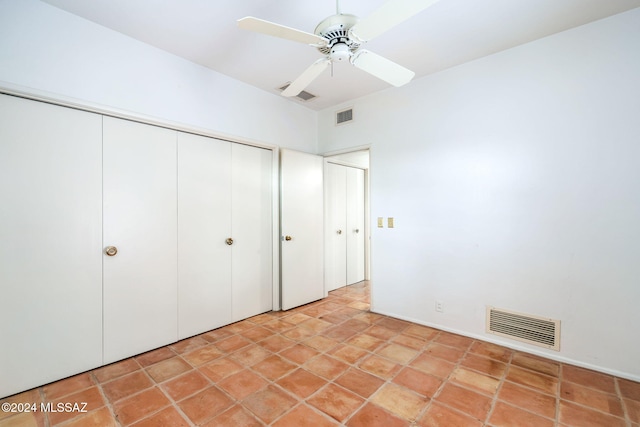 unfurnished bedroom with a closet and ceiling fan