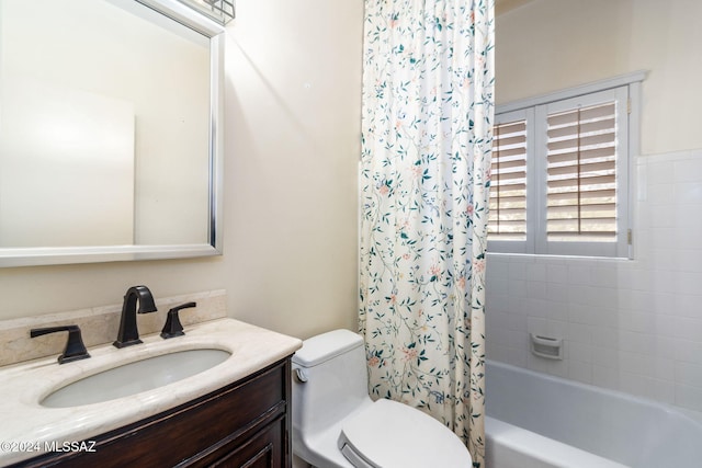 full bathroom with vanity, toilet, and shower / bath combination with curtain