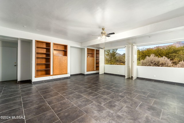 interior space featuring ceiling fan