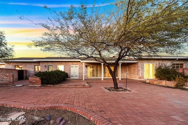 view of front of house with a patio area