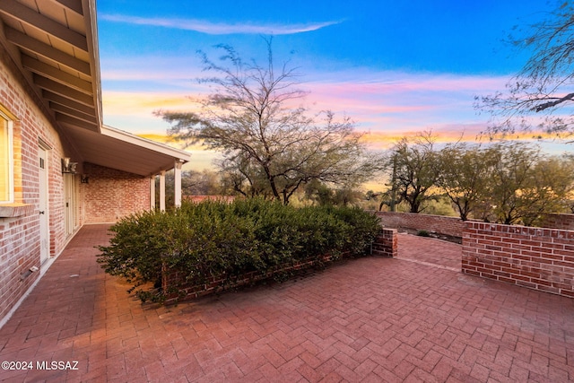 view of patio terrace at dusk