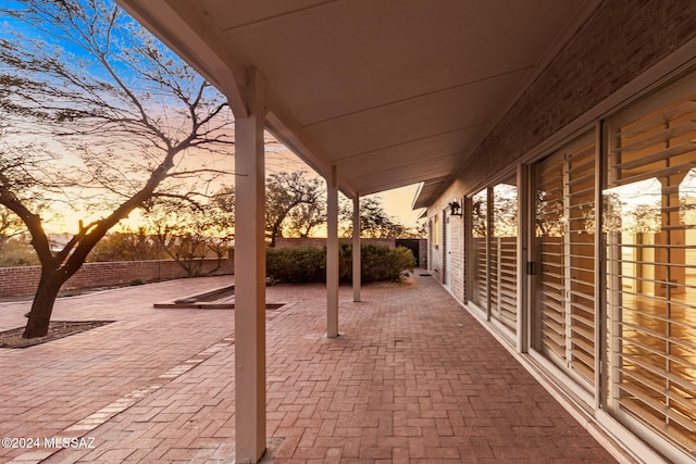 view of patio terrace at dusk