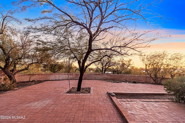 view of patio terrace at dusk