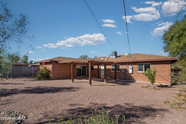 back of property featuring a patio, central AC, and a pergola