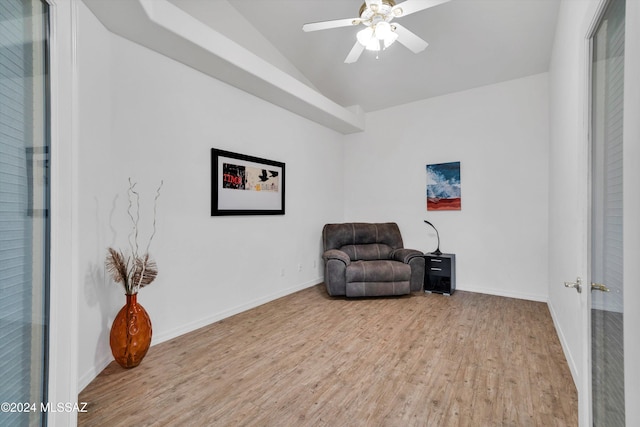 sitting room featuring ceiling fan, light hardwood / wood-style flooring, and vaulted ceiling