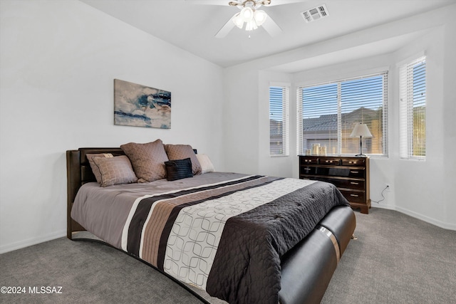 bedroom featuring ceiling fan and light carpet