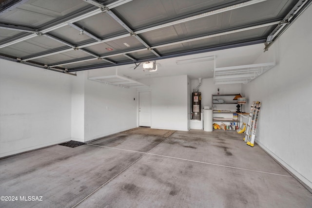 garage featuring water heater and a garage door opener