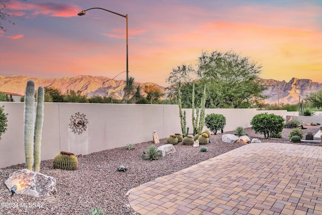 patio terrace at dusk with a mountain view