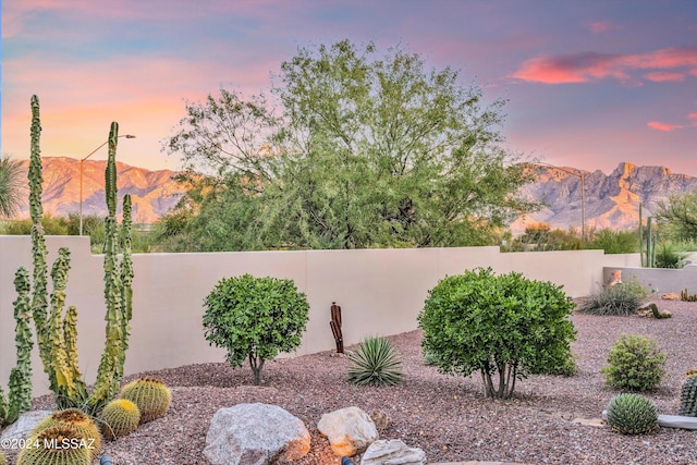 yard at dusk with a mountain view