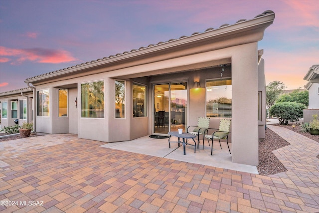 view of patio terrace at dusk