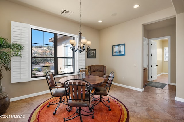 dining space with a notable chandelier