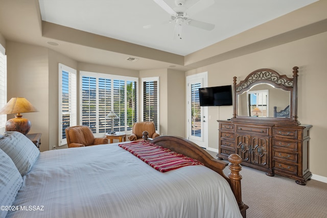 bedroom with ceiling fan, multiple windows, access to exterior, and carpet floors