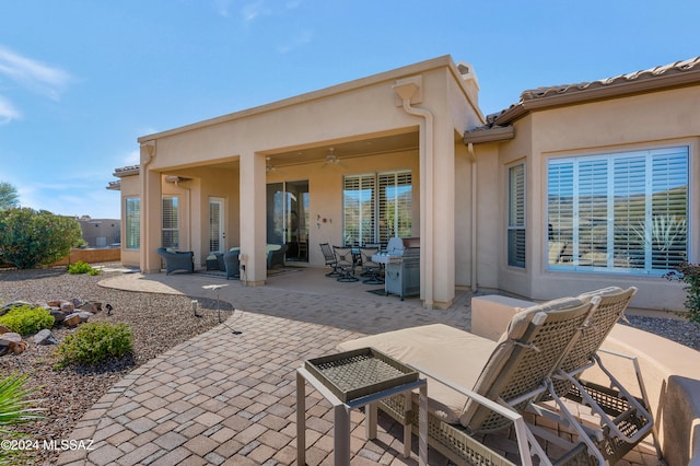 view of patio / terrace with area for grilling and ceiling fan