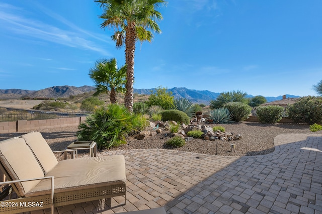 view of patio / terrace with a mountain view