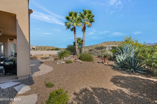 view of yard with a patio and a mountain view