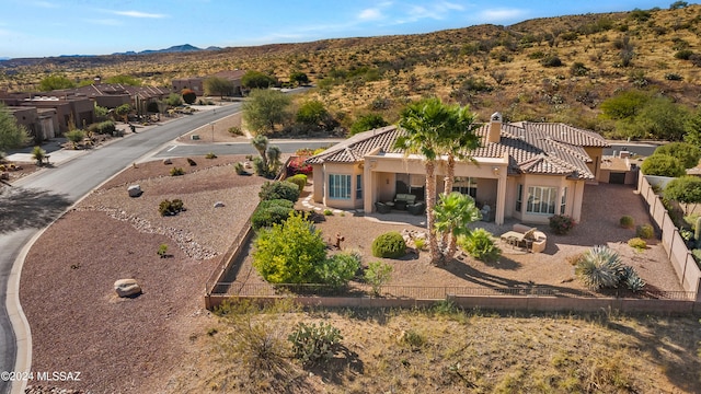 birds eye view of property with a mountain view