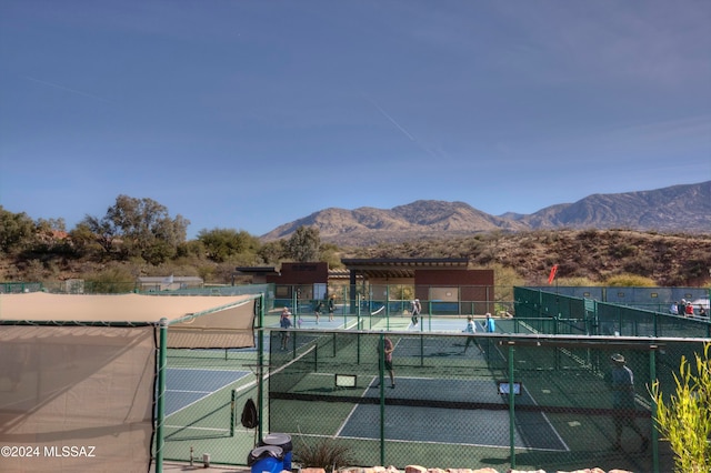 view of sport court with a mountain view