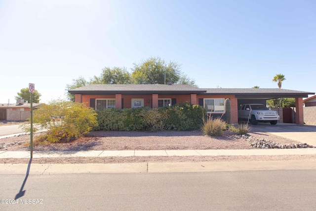 ranch-style house with a carport