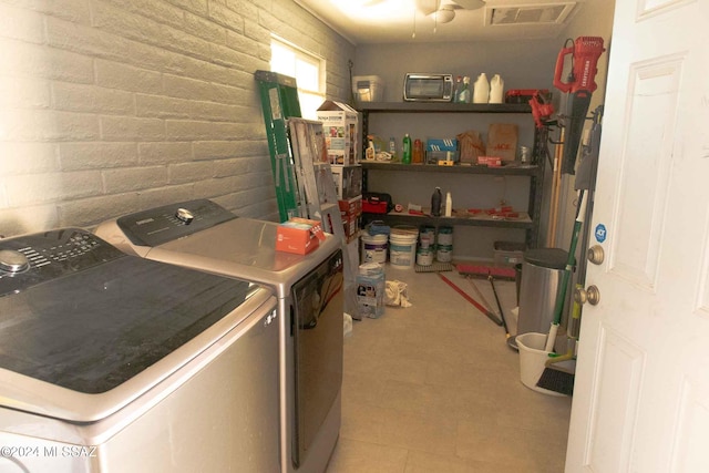 washroom featuring washer and dryer