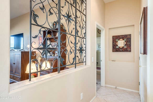 hallway featuring light tile patterned floors