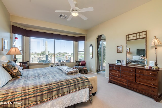 carpeted bedroom featuring access to outside and ceiling fan