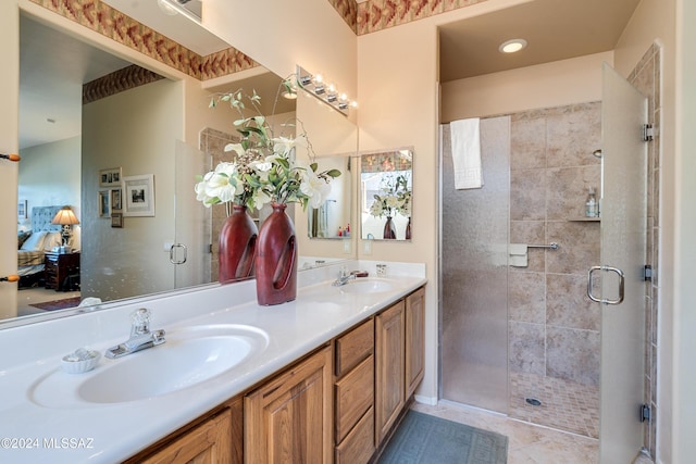 bathroom with tile patterned flooring, vanity, and a shower with shower door