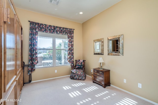 sitting room with light colored carpet